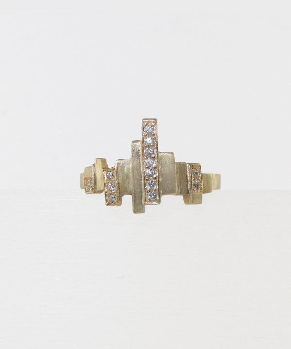 Contemporary gold ring with multiple bars and diamond accents