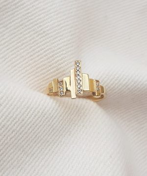 Contemporary gold ring with multiple bars and diamond accents