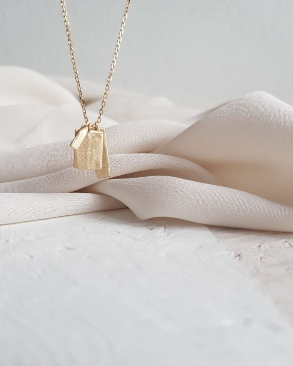 Gold Chime Necklace with three textured tags